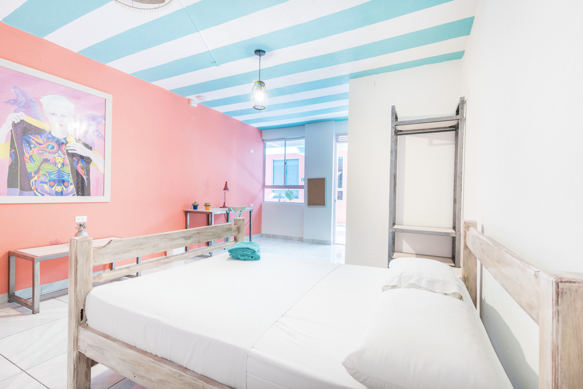 King-size-room-at-our-Coliving-space-in-Shared-offices-at-Flamingo-Coworking-Hostel-in-Santa-Marta-Colombia Private king room at Flamingo Coworking Hostel in Santa Marta Colombia